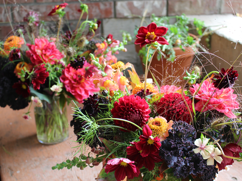 Fresh vase arrangements from the garden featuring dahlias in a fall palette